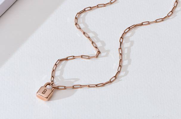 initial lock necklace in rose gold plating